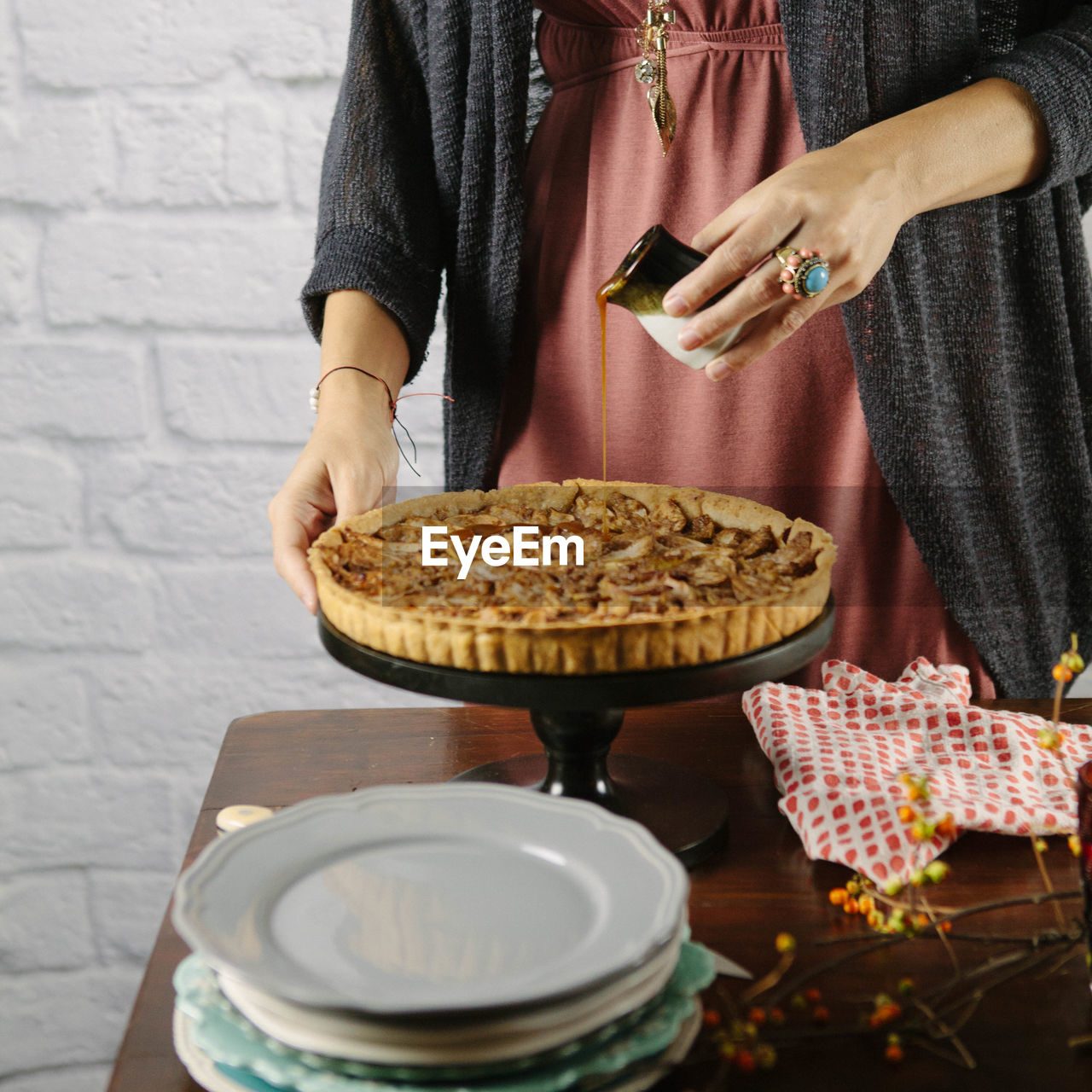 Midsection of woman preparing sweet pie