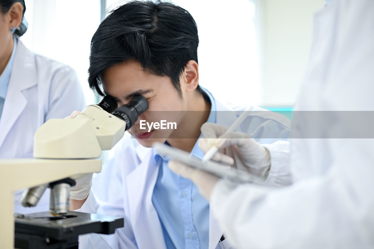 female doctor examining patient in clinic