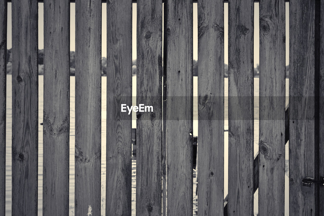wood, pattern, backgrounds, full frame, no people, textured, fence, security, day, black, close-up, protection, plank, wall, line, black and white, in a row, monochrome, old, outdoors, wall - building feature, floor, weathered, repetition, metal, side by side, architecture, monochrome photography, built structure