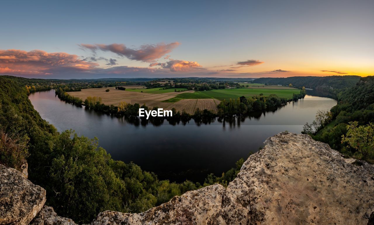 Scenic view of landscape against sky during sunset