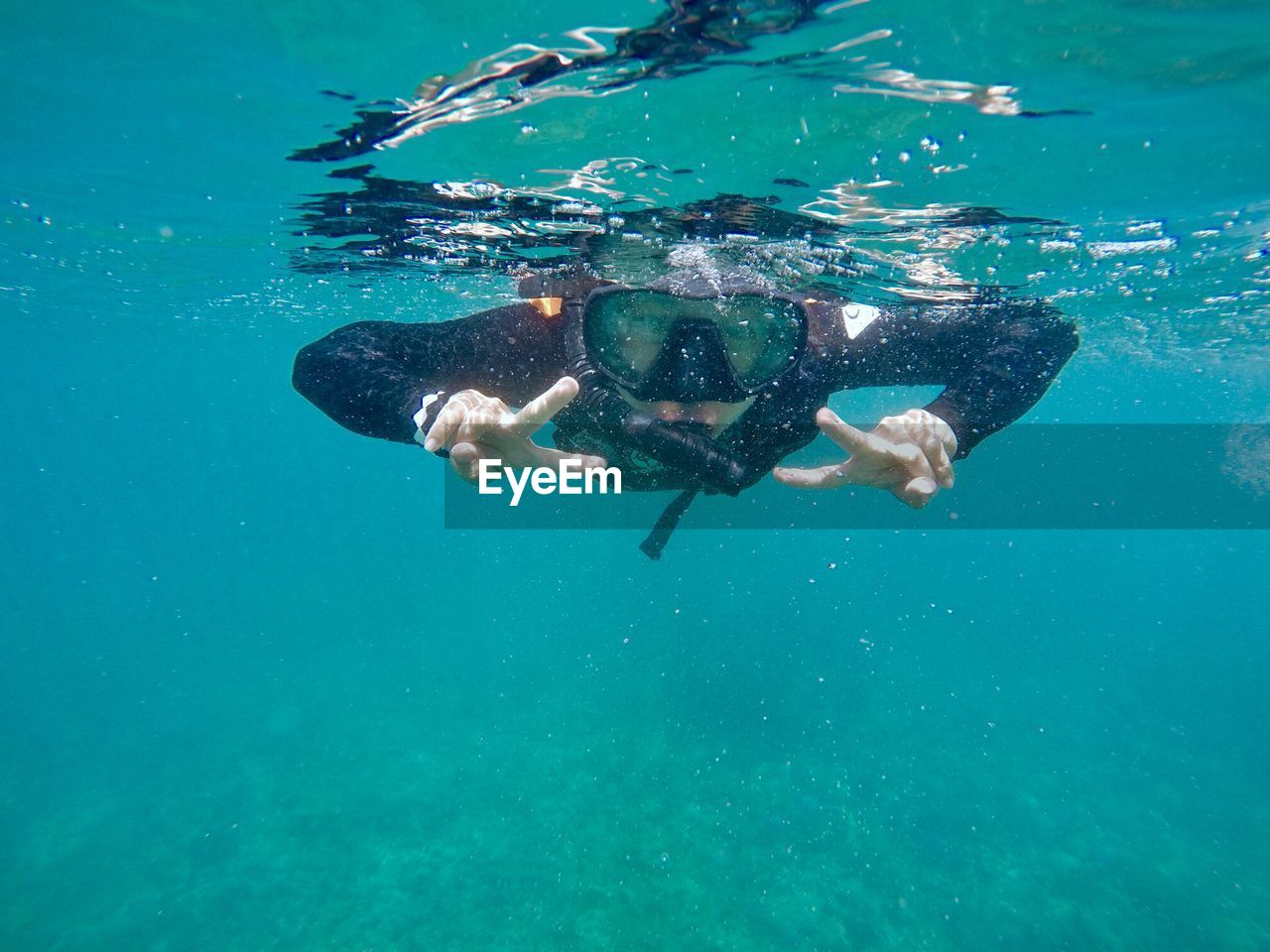 Close-up of man swimming in sea