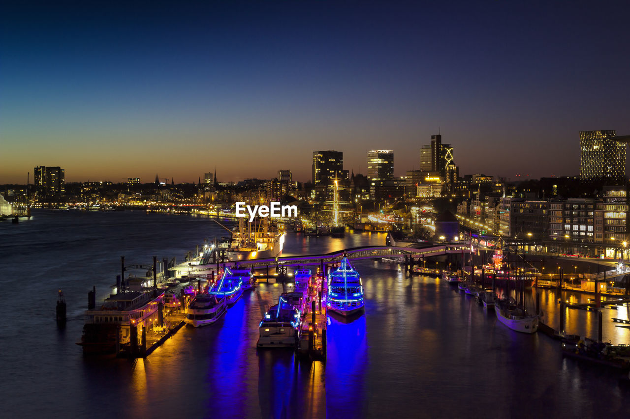 View of illuminated city at waterfront