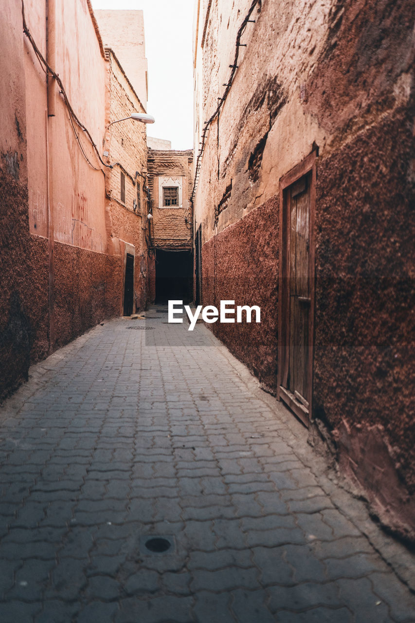 NARROW ALLEY AMIDST BUILDINGS