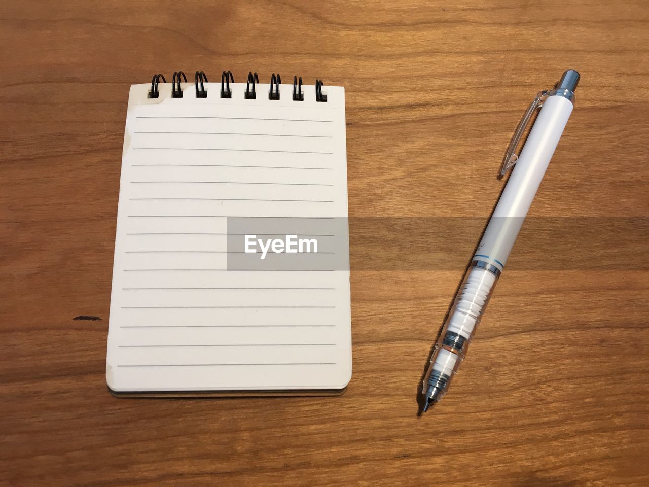 Close-up of pen and book on table