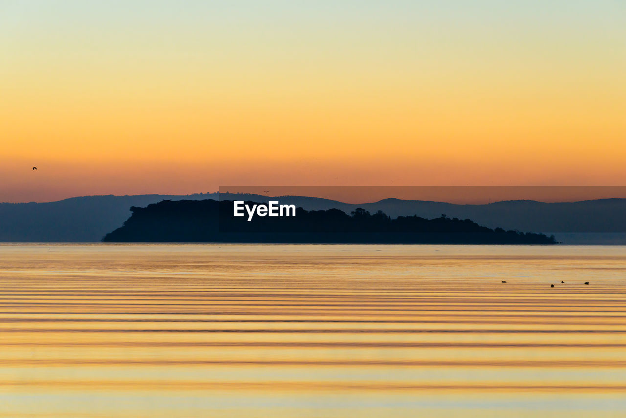 Scenic view of mountains against sky during sunset