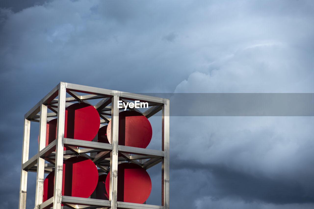cloud, sky, architecture, storm, nature, storm cloud, overcast, built structure, red, tower, building exterior, no people, building, dramatic sky, cloudscape, outdoors, sign, low angle view, warning sign, gray, protection, copy space, day, security