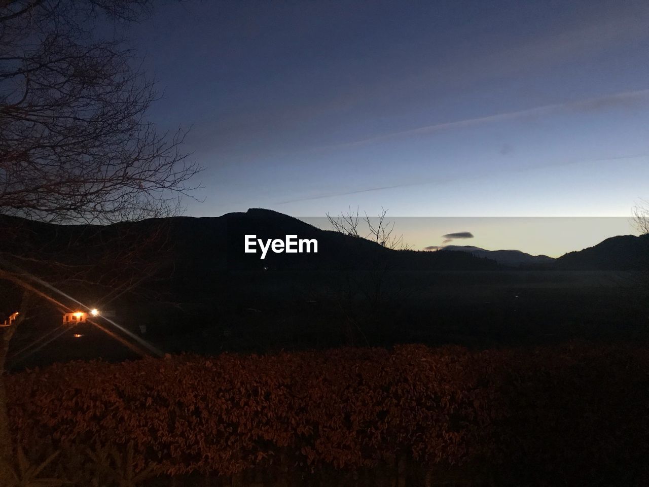 SCENIC VIEW OF MOUNTAIN AGAINST SKY AT NIGHT
