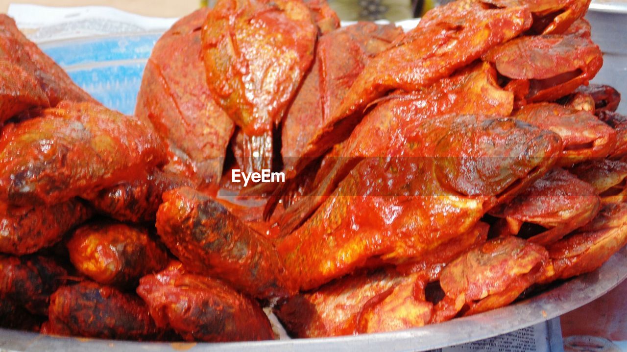 CLOSE-UP OF MEAT ON GRILL