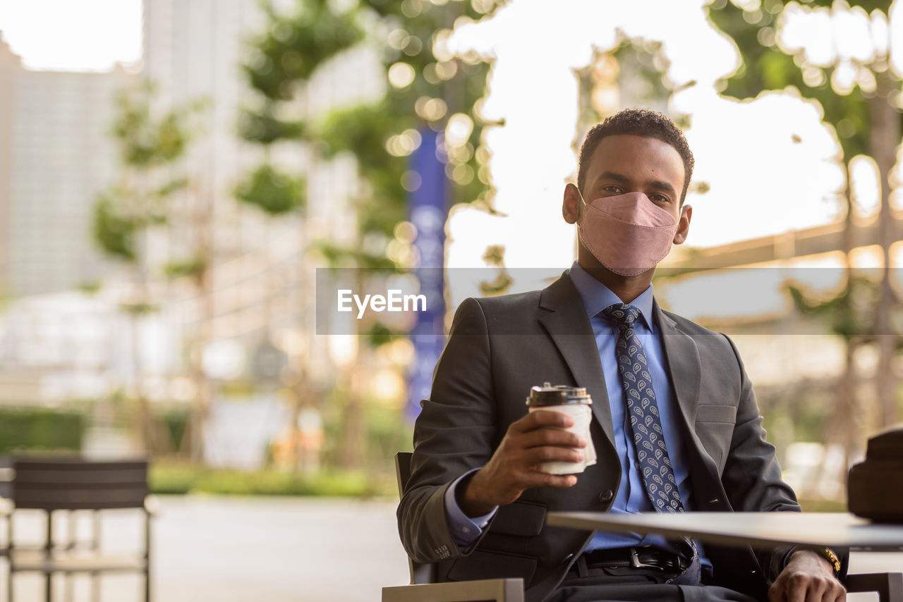 portrait of businessman using mobile phone