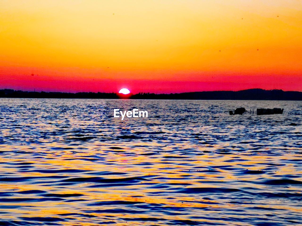 SCENIC VIEW OF SEA DURING SUNSET