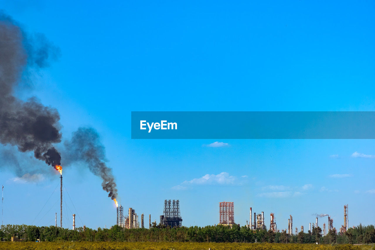 A hydrocarbon plant polluting the environment in the city of mendoza, argentina.