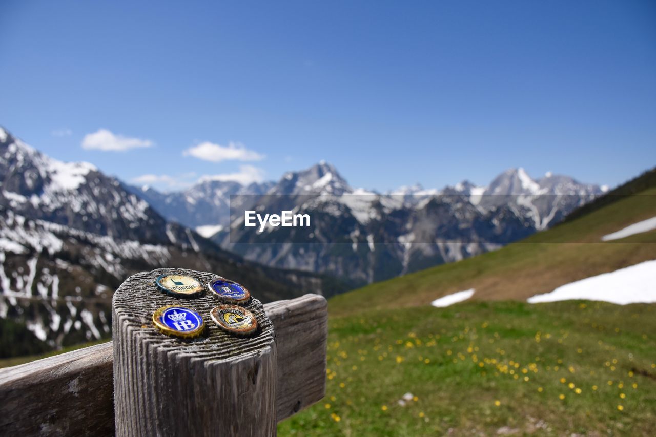 Scenic view of snowcapped mountains against blue sky