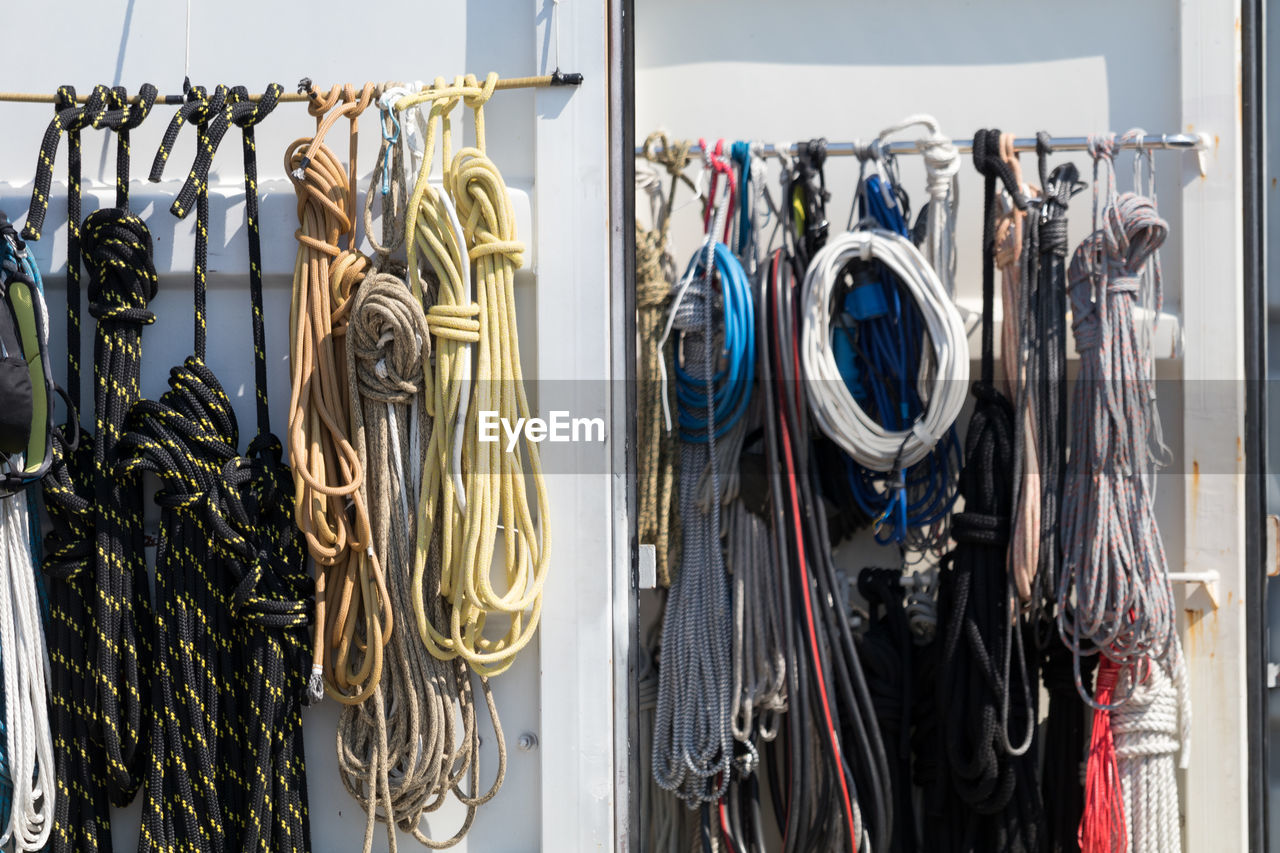 Colorful ropes hanging at harbor