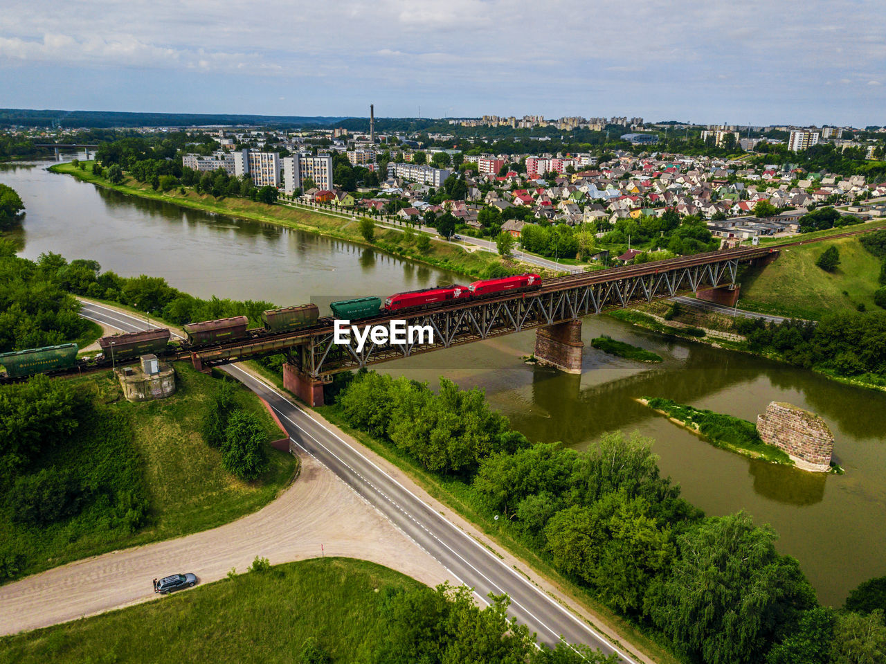 High angle view of bridge over river in city against sky