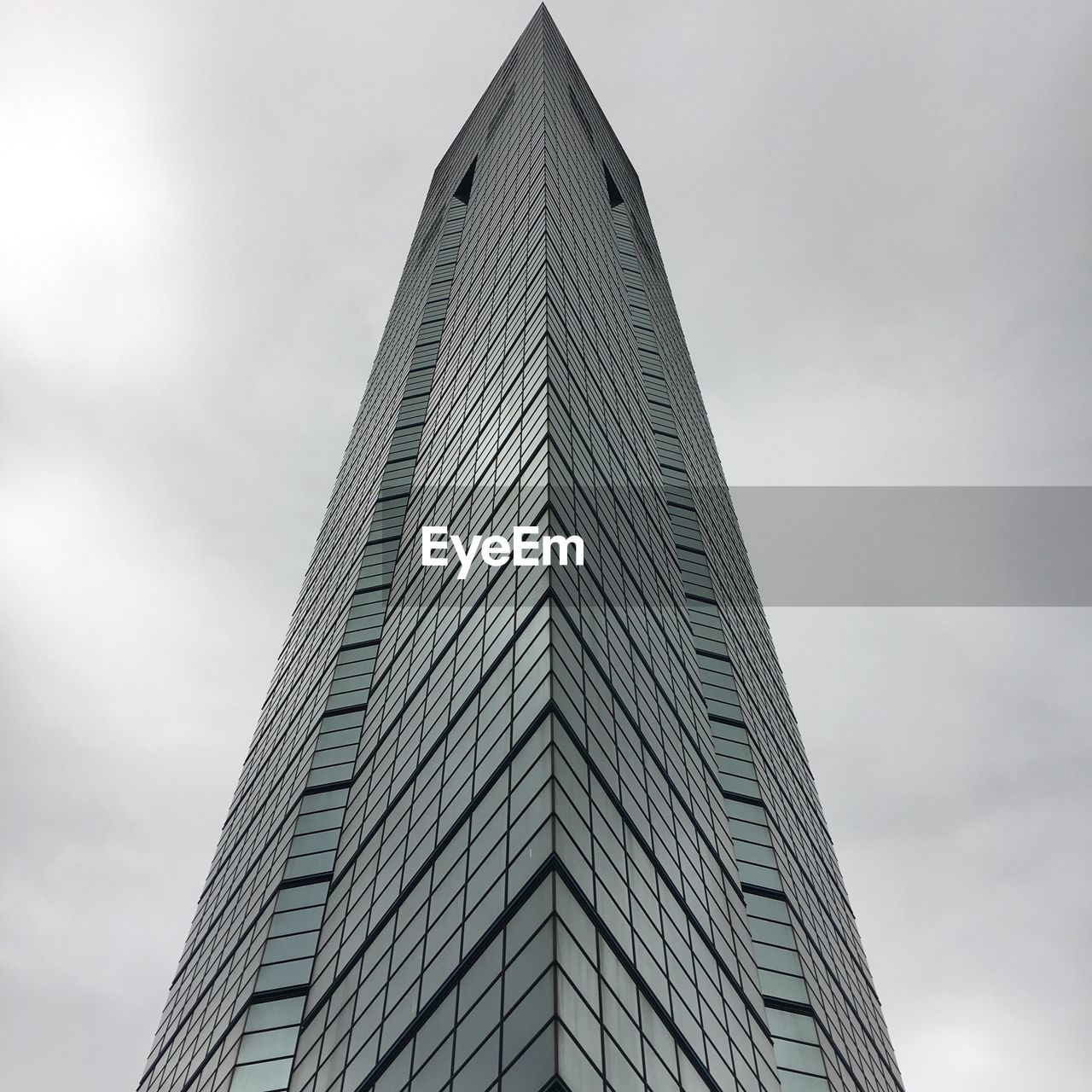 Low angle view of skyscraper against sky