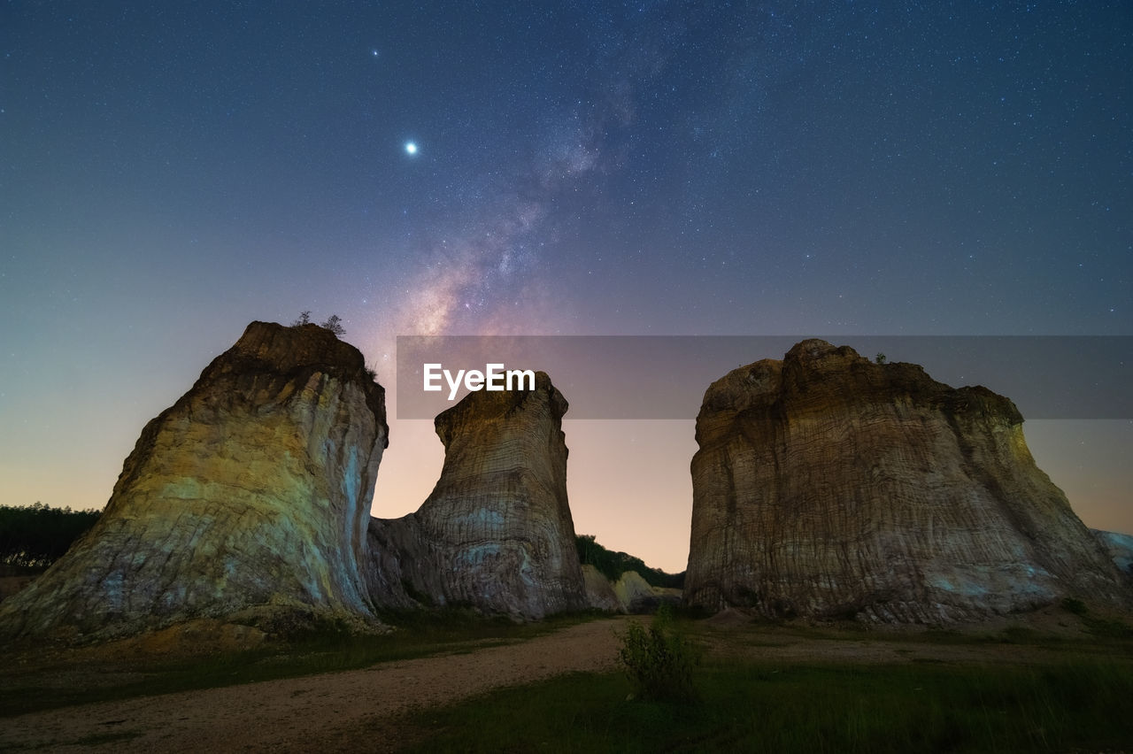 SCENIC VIEW OF ROCK FORMATIONS AT NIGHT