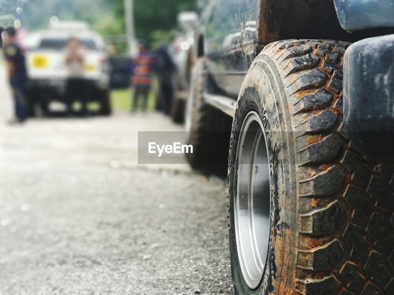 Close-up of dirty vehicle tire on road