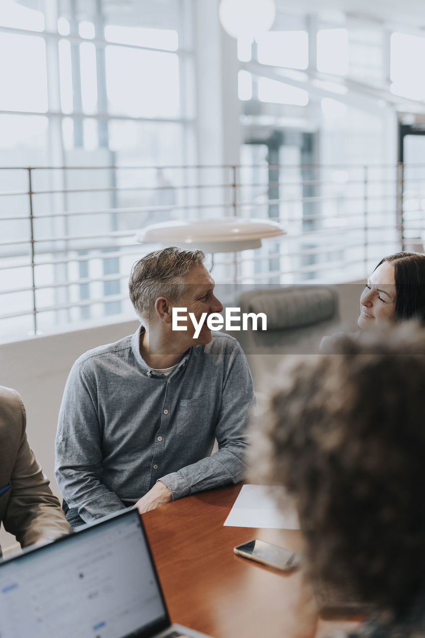 Smiling man at business meeting