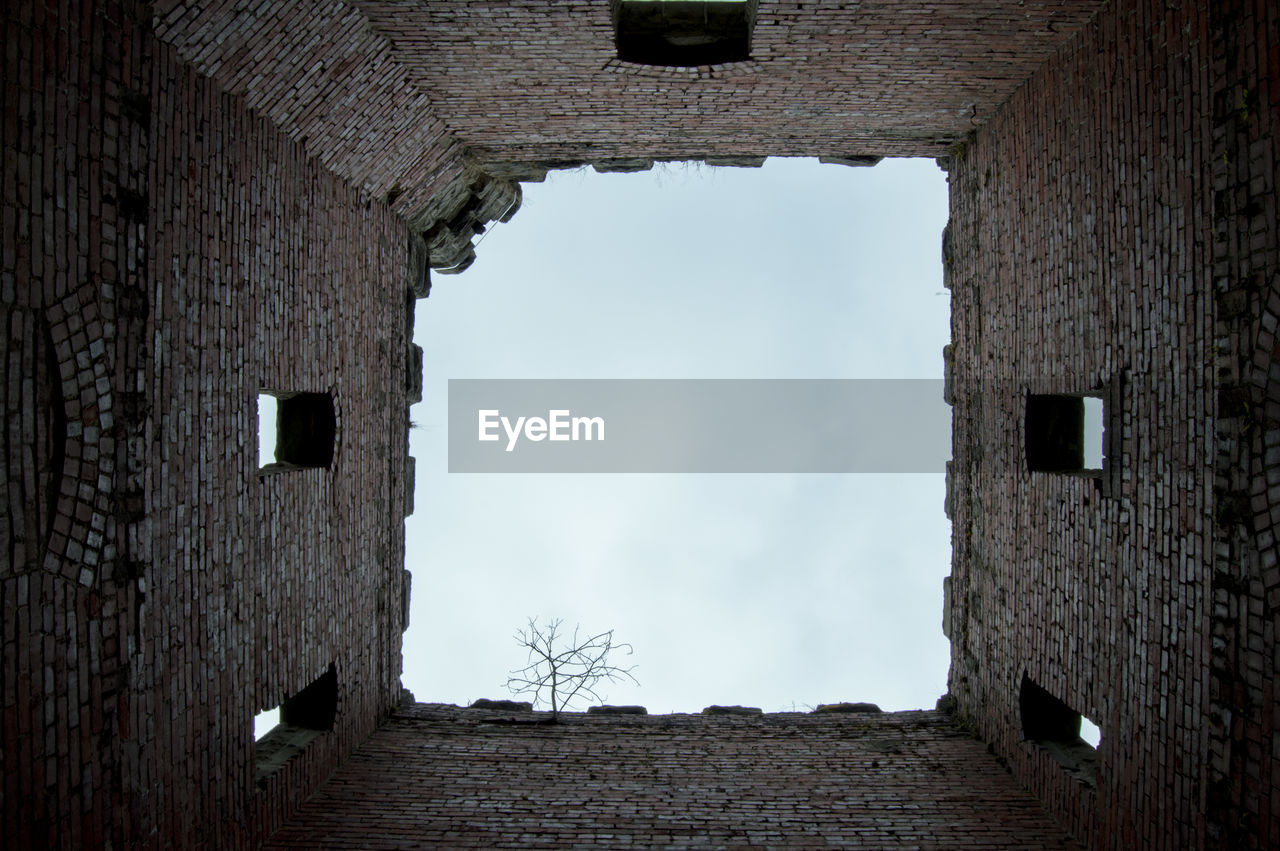 Abandoned building against sky