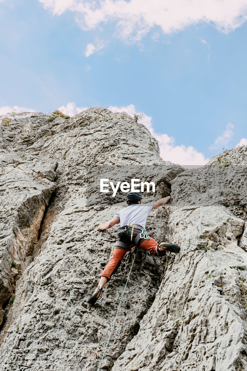 rear view of man walking on mountain