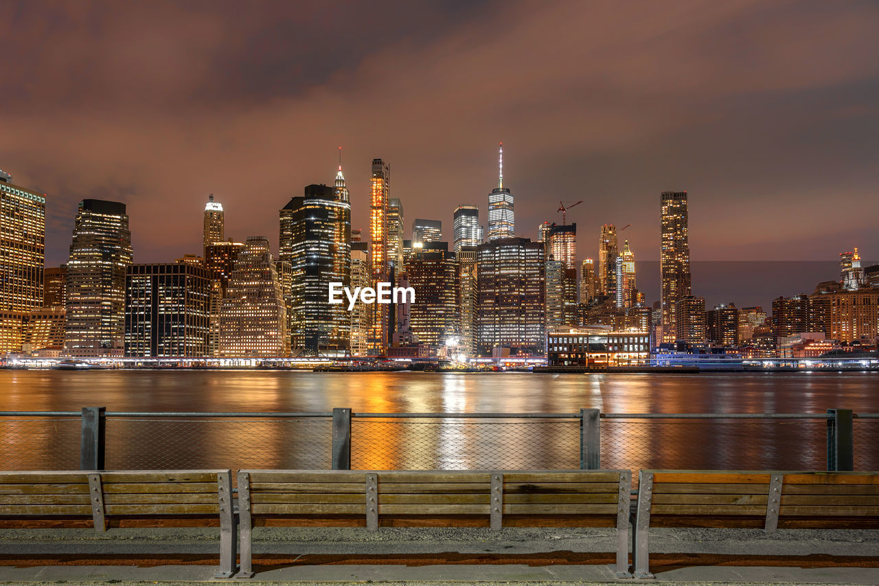 New york cityscape beside the east river at the night time, usa downtown, architecture and building