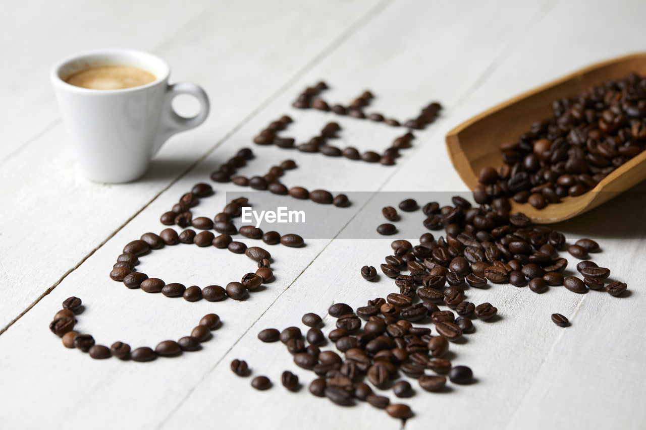 food and drink, coffee, coffee cup, cup, drink, roasted coffee bean, food, mug, hot drink, refreshment, studio shot, freshness, indoors, brown, scented, coffee break, no people, still life, black coffee, tea, crockery, table, copy space, tableware, seed, close-up, black