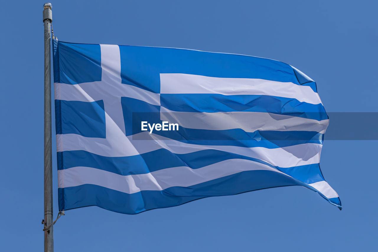 flag, blue, patriotism, sky, wind, environment, nature, low angle view, no people, clear sky, azure, pole, striped, symbol, white, outdoors, shape, day