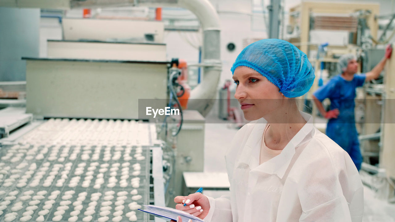 Portrait of woman working in factory