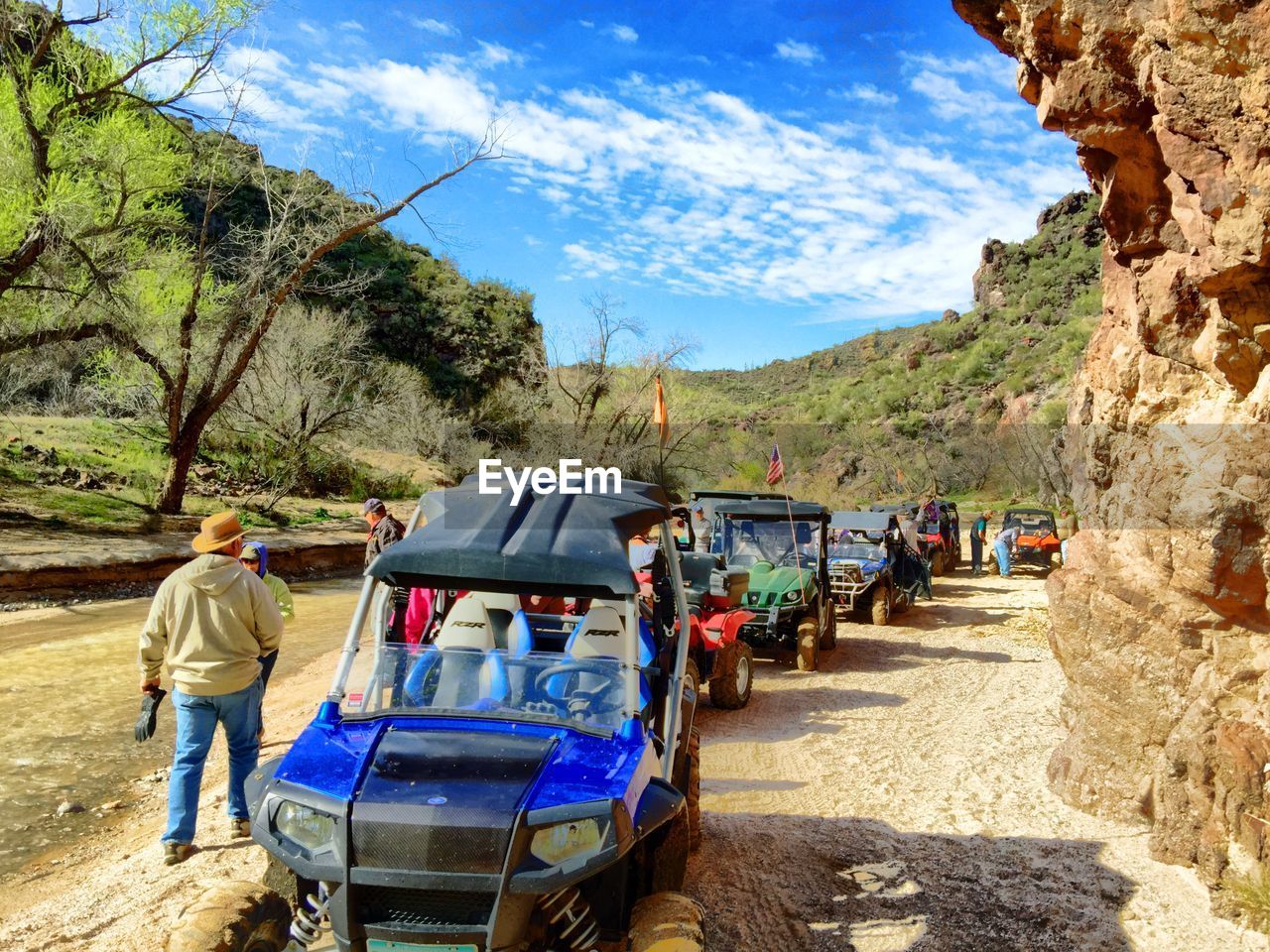 PEOPLE ON MOUNTAIN ROAD