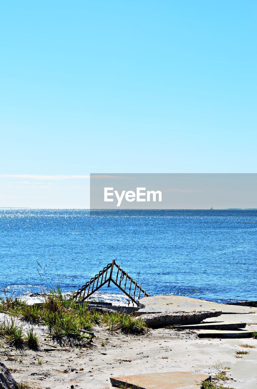 Scenic view of sea against blue sky