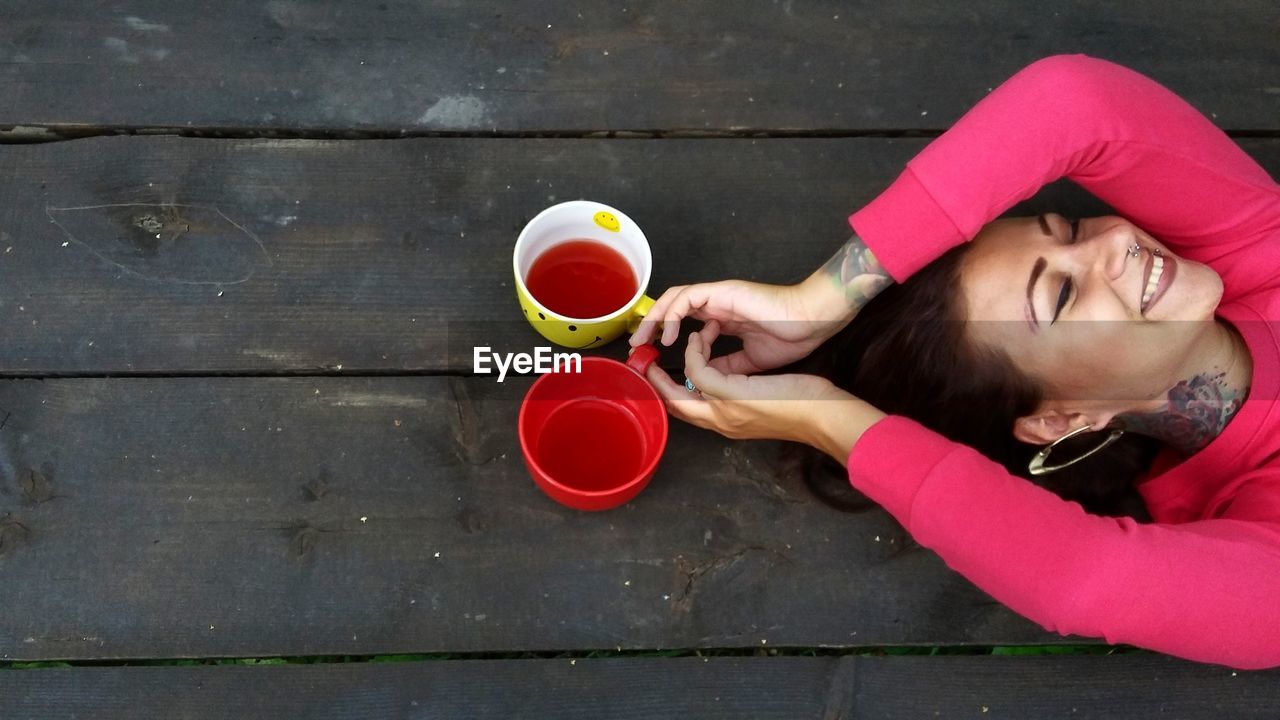 Woman holding mugs