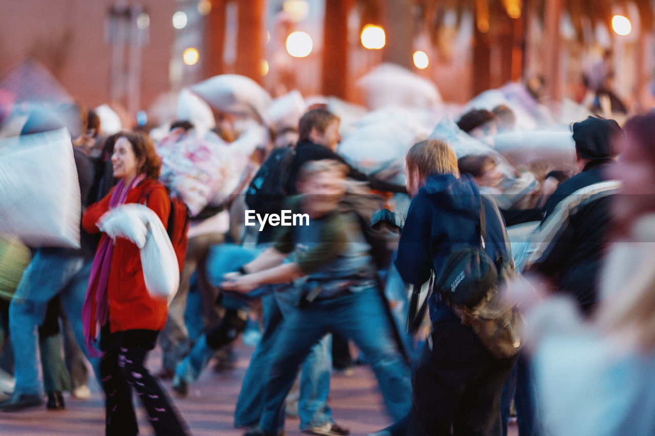 GROUP OF PEOPLE WALKING IN STREET