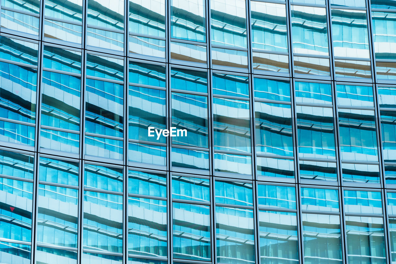 LOW ANGLE VIEW OF GLASS BUILDING