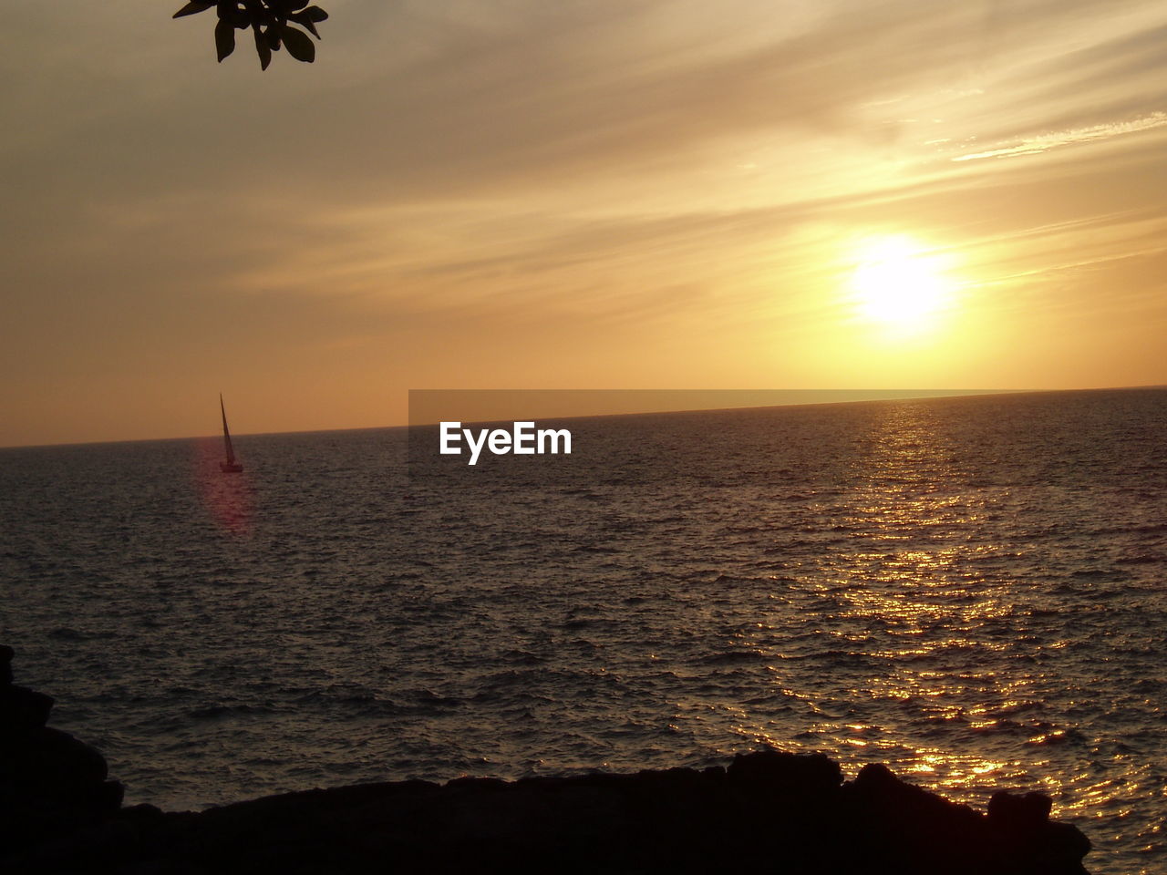 SCENIC VIEW OF SUNSET OVER SEA