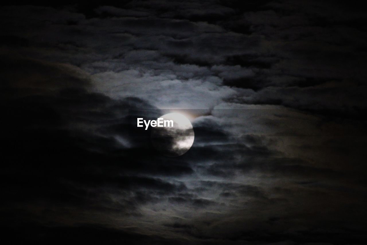 LOW ANGLE VIEW OF MOON AGAINST SKY