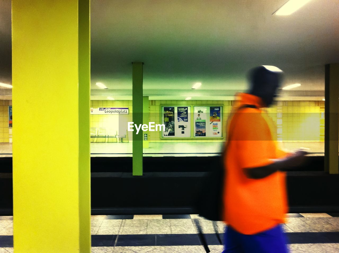 WOMAN STANDING IN SUBWAY