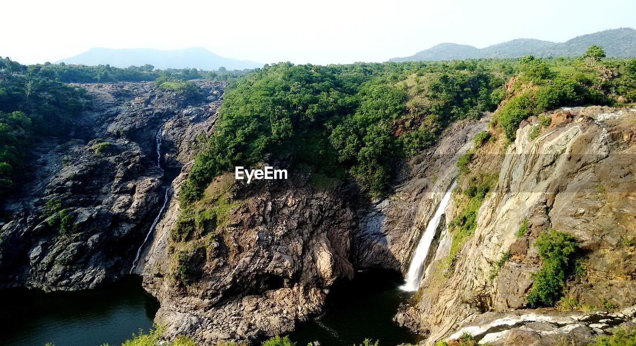 Panoramic view of cliffs on landscape against sky