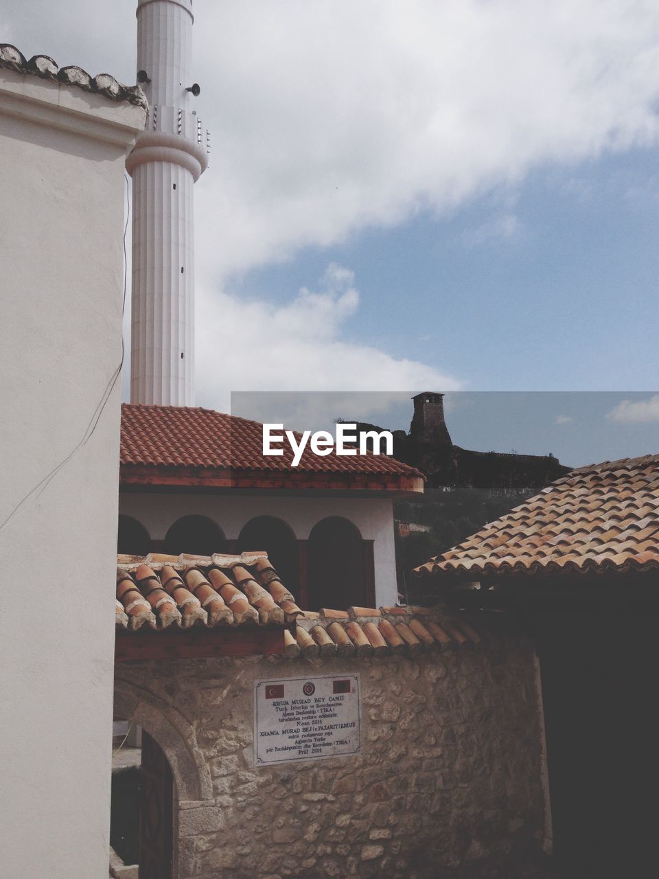 View of mosque against cloudy sky