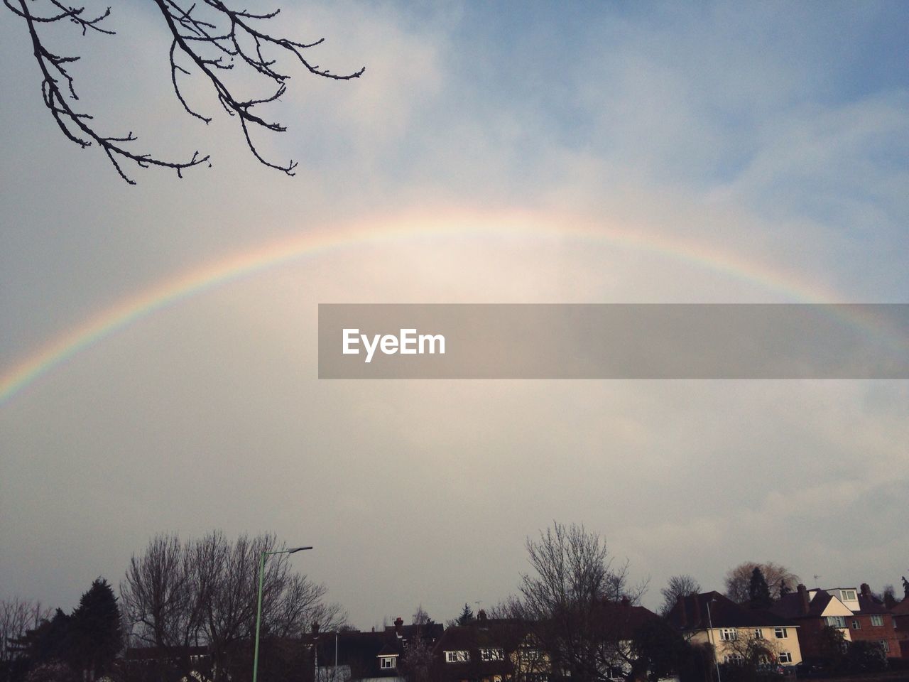 SCENIC VIEW OF RAINBOW OVER MOUNTAINS