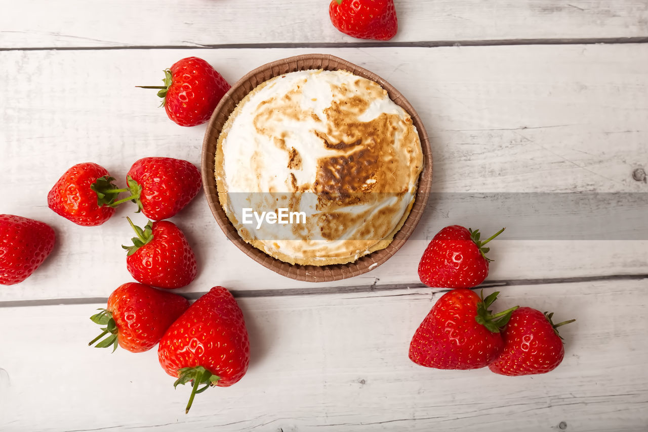 food and drink, strawberry, food, berry, healthy eating, fruit, freshness, red, wood, plant, dessert, wellbeing, indoors, produce, studio shot, sweet food, breakfast, no people, directly above, still life, table, sweet, dish, high angle view, meal, dairy, bowl, rustic