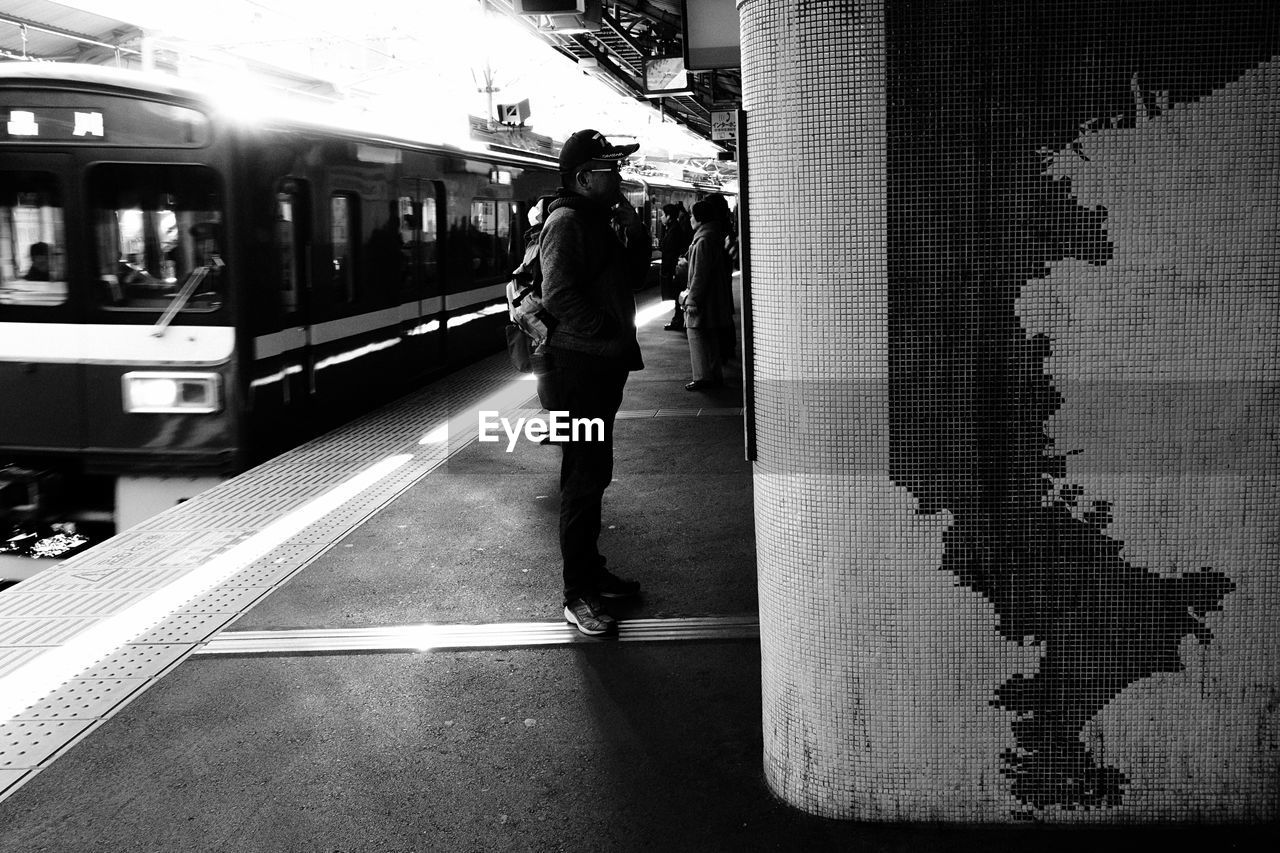 MAN STANDING ON FLOOR