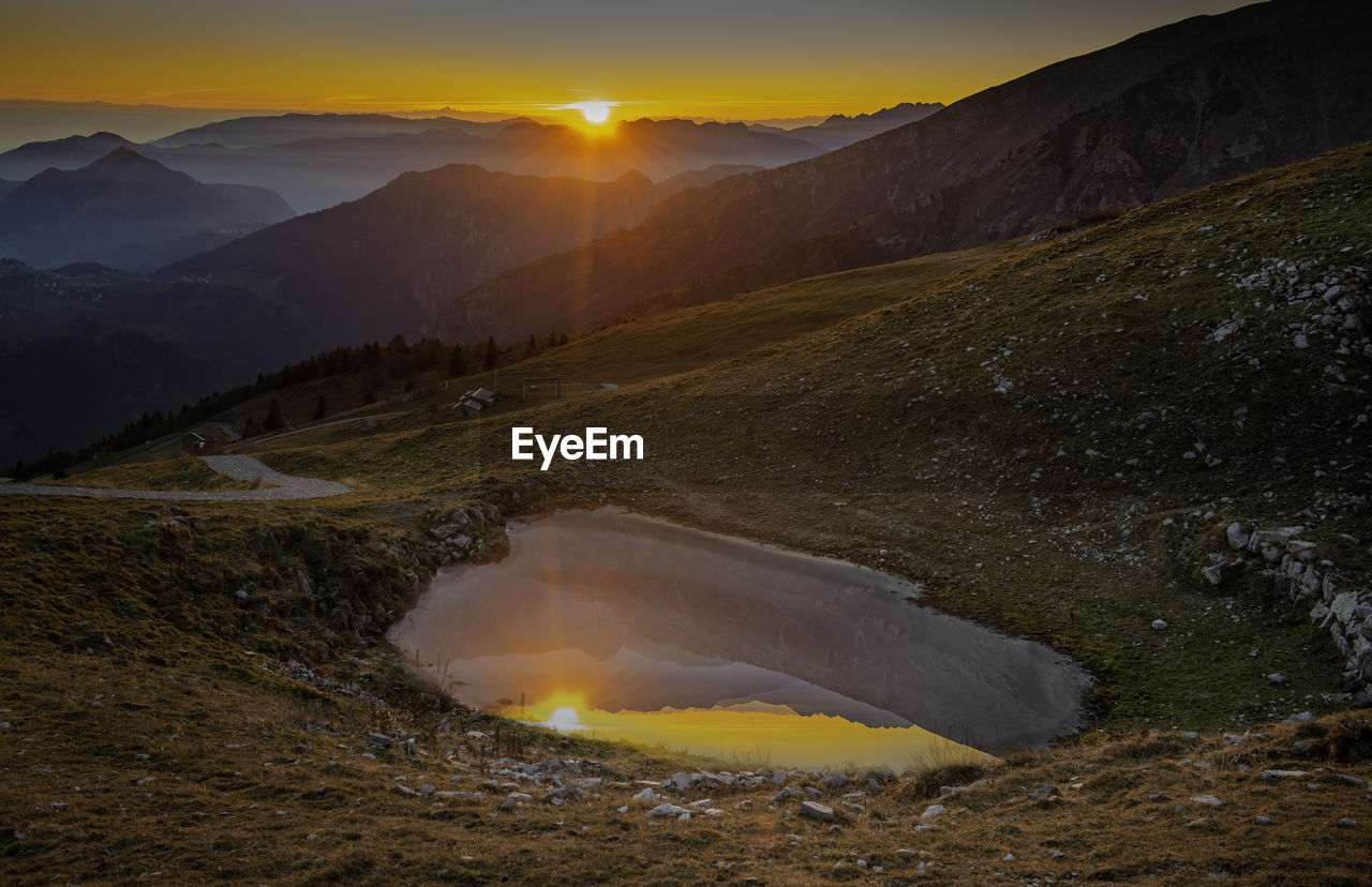 Scenic view of landscape against sky during sunset