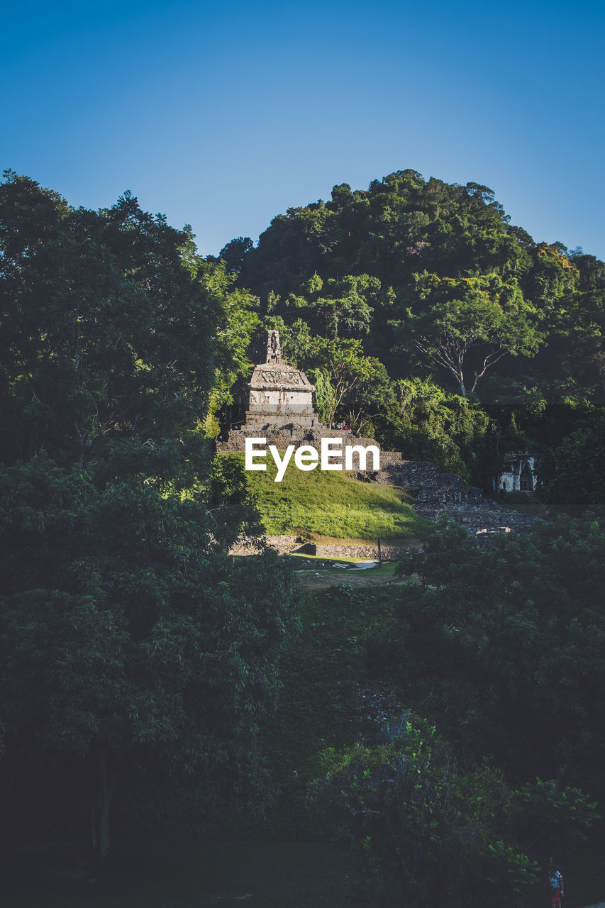 VIEW OF TEMPLE AGAINST MOUNTAIN