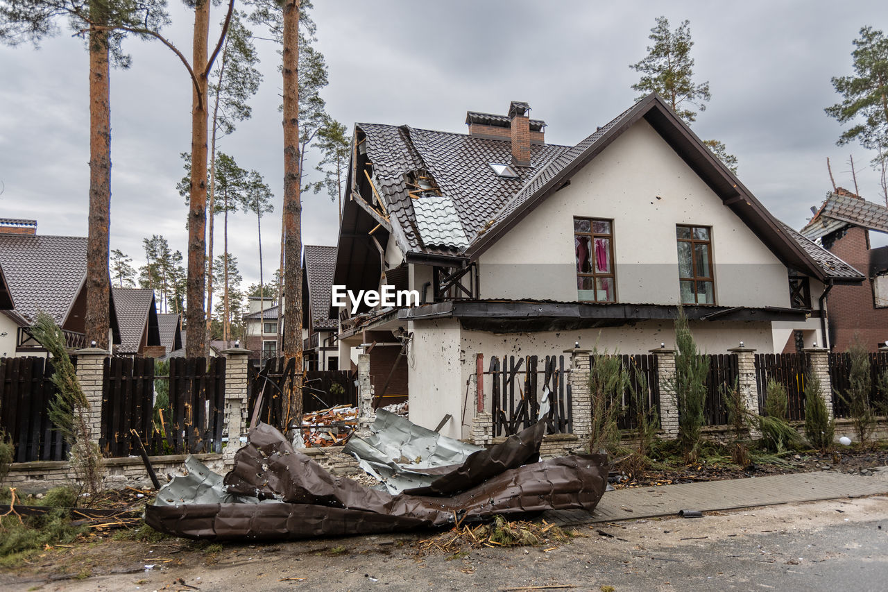 Destroyed buildings on the streets of irpen. broken windows. buildings after being hit by missiles.