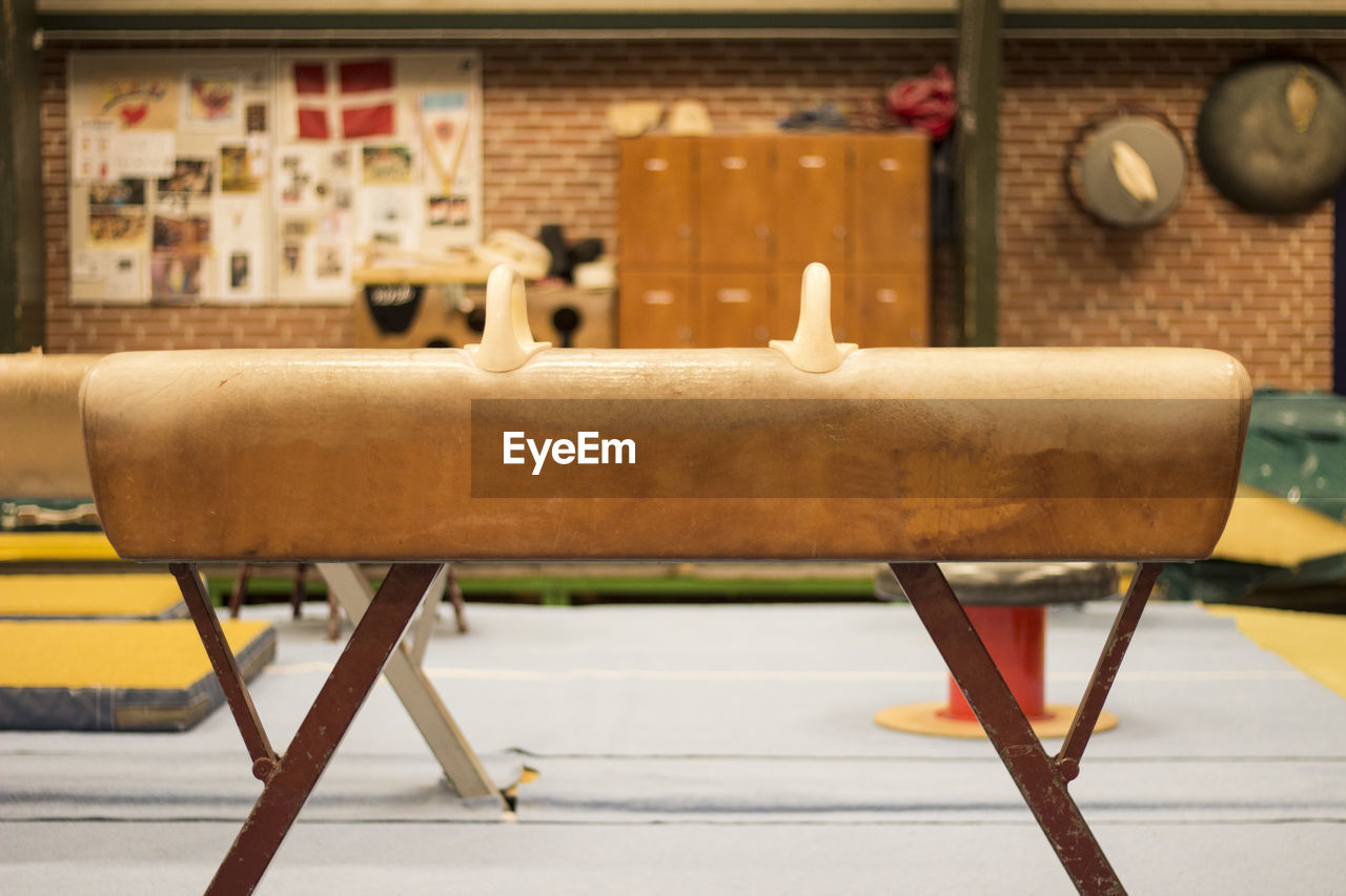 CLOSE-UP OF EMPTY CHAIRS AND TABLE