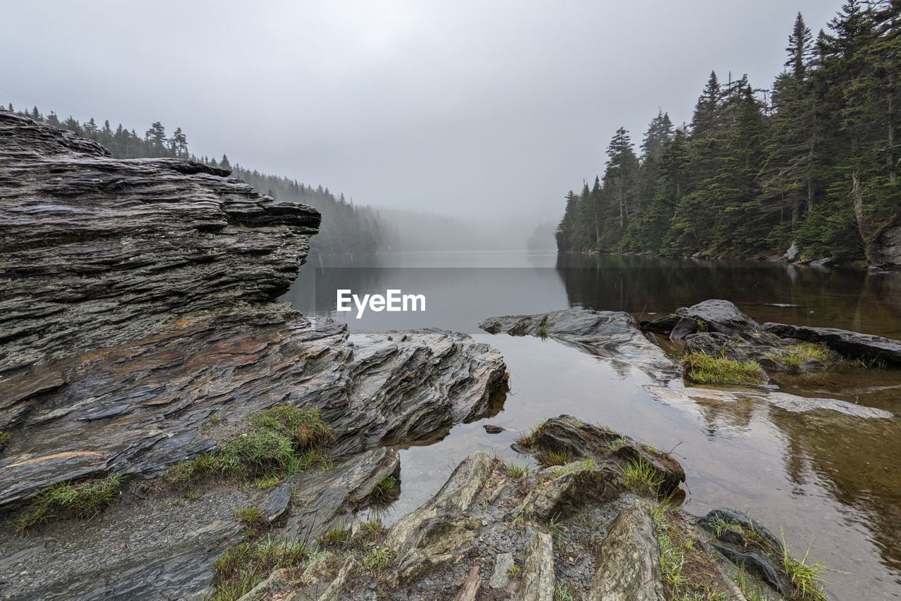 scenic view of waterfall against sky