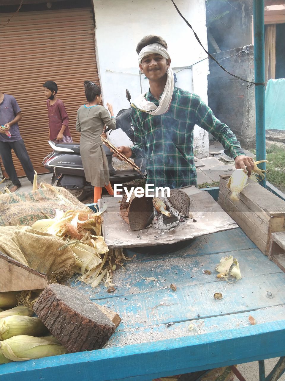 MAN WORKING AT MARKET STALL