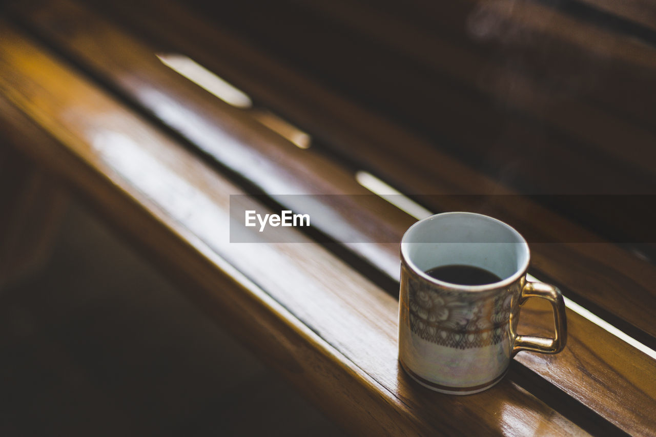 High angle view of coffee cup on table in the church