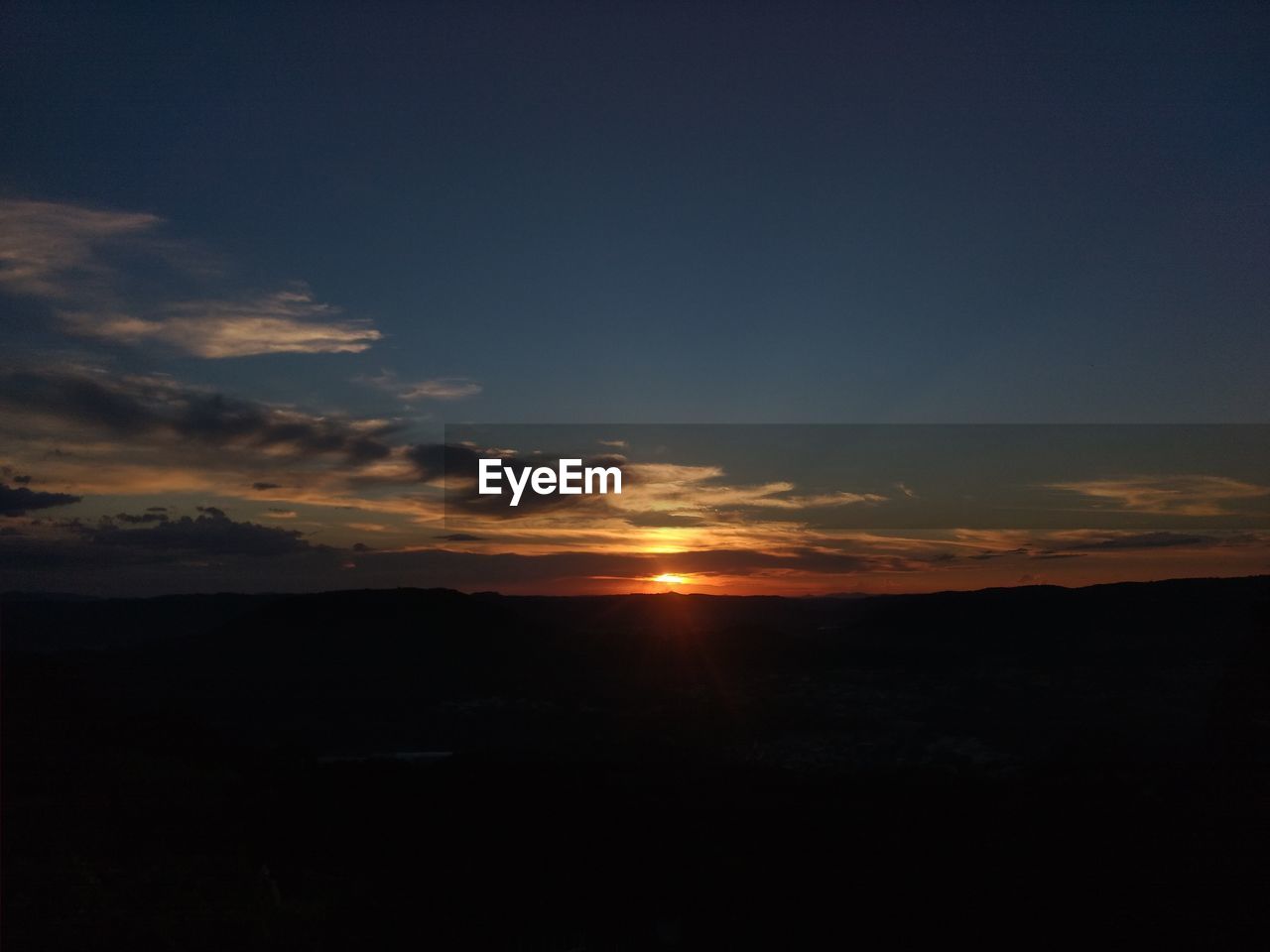 SILHOUETTE LANDSCAPE AGAINST SKY DURING SUNSET