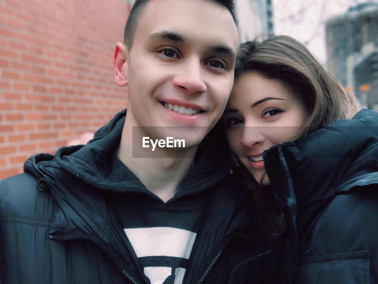 Portrait of smiling couple wearing warm clothing